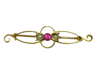 Lot 6 - Two 15ct gold brooches and a selection of loose gemstones.