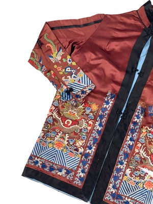 Lot 1023 - A Chinese silk embroidered jacket, early 20th century.