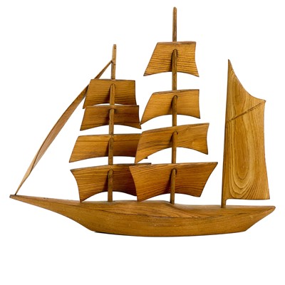 Lot 148 - A Cornish carved elm model of a sailing ship.