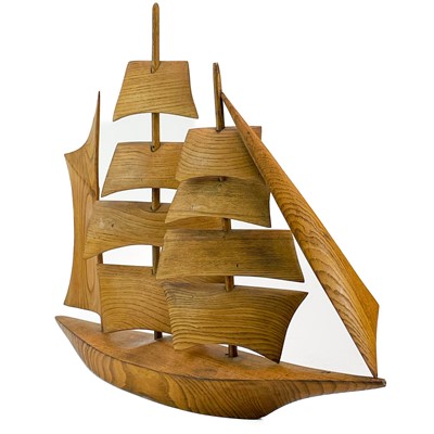 Lot 148 - A Cornish carved elm model of a sailing ship.