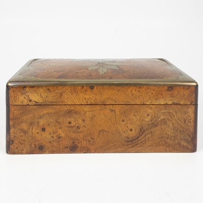 Lot 85 - A Continental elm and brass inlaid trinket box.