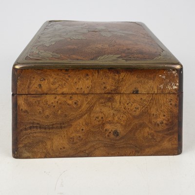 Lot 85 - A Continental elm and brass inlaid trinket box.