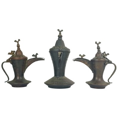 Lot 66 - Three Saudi Arabian copper dallah pots.