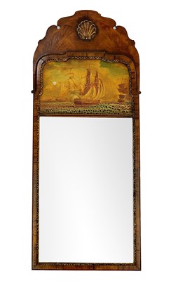 Lot 682 - A Queen Anne style walnut wall mirror.