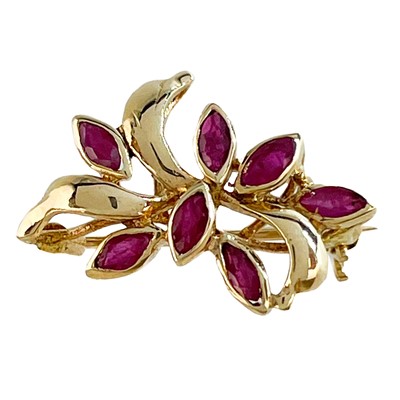 Lot 194 - A 9ct diamond and sapphire set horseshoe bar brooch and a 9ct ruby set floral brooch.