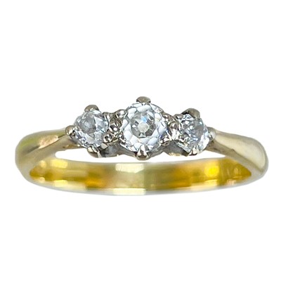 Lot 3 - An 18ct and platinum diamond set three stone ring.