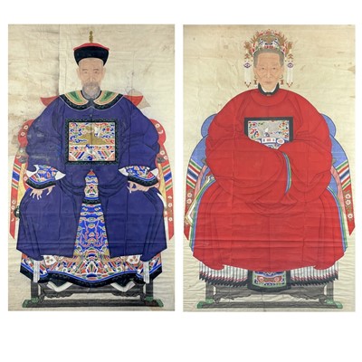 Lot 1054 - A large pair of Chinese ancestor portrait paintings, 19th century.