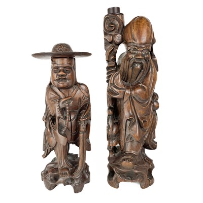 Lot 1134 - Two Chinese carved hardwood figures, early 20th century.