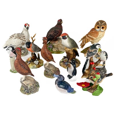 Lot 512 - A collection of hand painted ceramic birds.