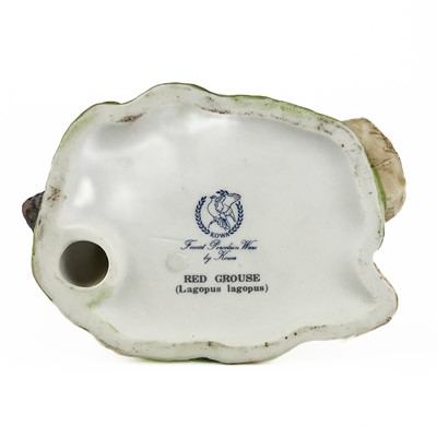 Lot 512 - A collection of hand painted ceramic birds.