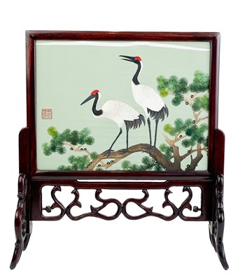 Lot 1150 - A Chinese silk embroidered glazed table screen, 20th century.