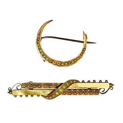 Lot 110 - An Edwardian 15ct seed pearl set bar brooch and a 14ct pearl set crescent brooch.