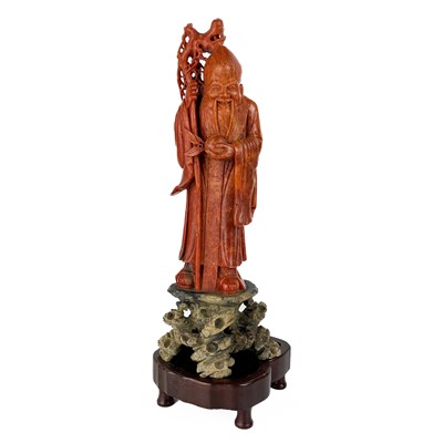 Lot 1163 - A Chinese carved soapstone figure of Shou Lao.