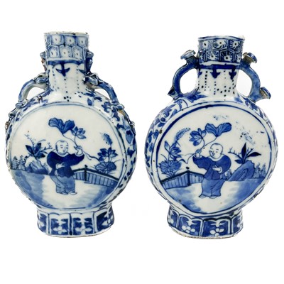 Lot 1166 - Two similar Chinese blue and white porcelain moon flasks, 19th century.