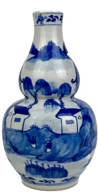 Lot 1173 - A Chinese blue and white porcelain double gourd vase, late 19th century.