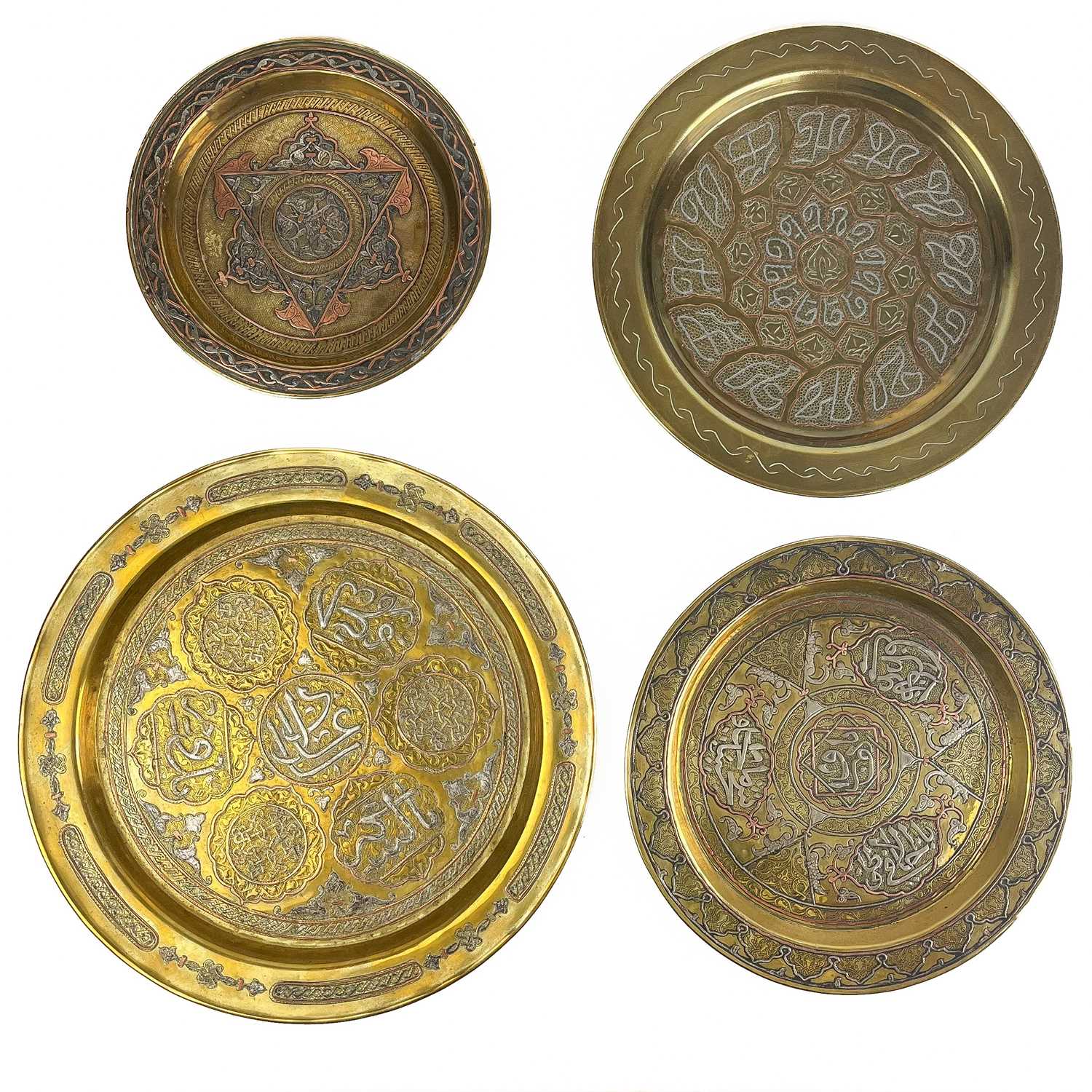 Lot 78 - Two Cairoware brass and silver inlaid trays, Egypt, circa 1900.