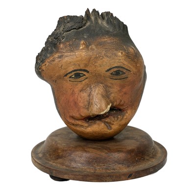 Lot 22 - A pair of folk art 'hedgerow' carved treen and painted heads.