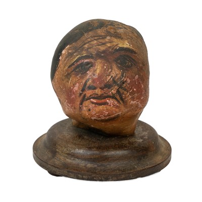 Lot 22 - A pair of folk art 'hedgerow' carved treen and painted heads.