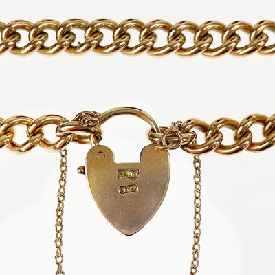 Lot 21 - A 9ct gold curb link bracelet with padlock clasp.