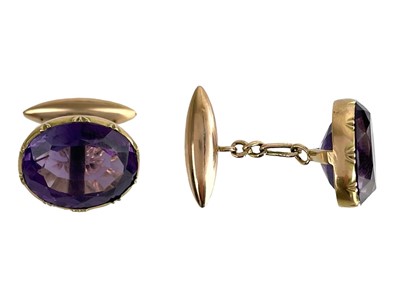 Lot 241 - A pair of Edwardian gold oval cut amethyst set cufflinks.