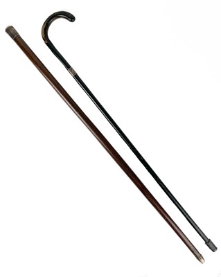 Lot 110 - A silver top tropical hardwood walking cane.