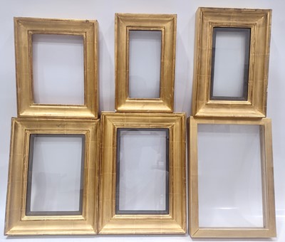 Lot 294 - Six glazed gilt picture frames of composite construction.