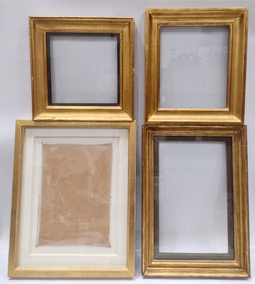 Lot 299 - Four glazed gilt picture frames of composite construction.