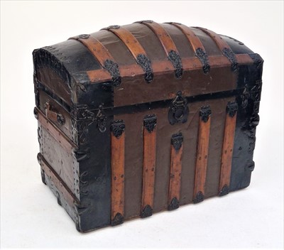 Lot 3412 - A wooden and metal bound domed top trunk,...