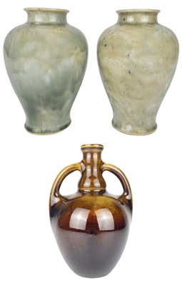 Lot 472 - A near pair of Royal Doulton stoneware baluster vases