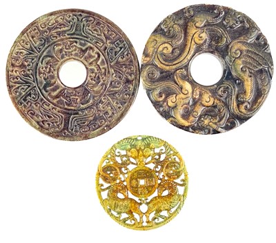 Lot 1223 - Three Chinese carved jadeite roundels.