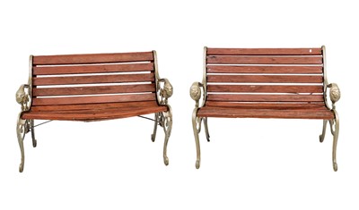 Lot 360 - A pair of cast iron garden benches.