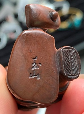 Lot 728 - A Japanese carved wood netsuke, signed, height...