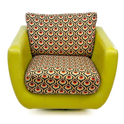 Lot 747 - A lime green leatherette and upholstered swivel chair by Rondo.