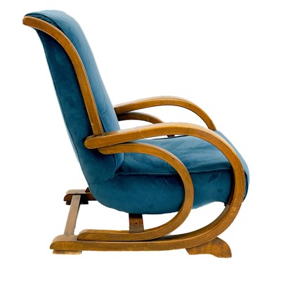 Lot 734 - A mid-century stained beech and upholstered Suparest armchair.