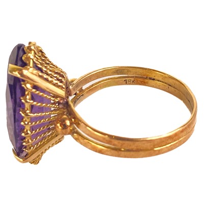 Lot 41 - An 18ct synthetic marquise cut purple corundum stone set ring.