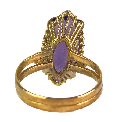Lot 41 - An 18ct synthetic marquise cut purple corundum stone set ring.