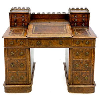 Lot 739 - A Victorian burr walnut twin pedestal writing desk.