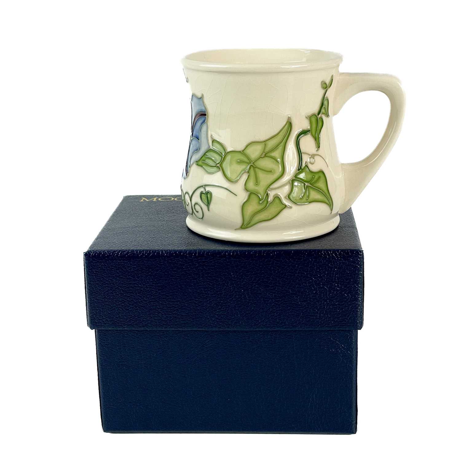 Lot 471 A Moorcroft Pottery trial Morning Glory mug.
