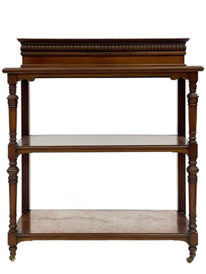 Lot 651 - A late Victorian walnut three tier buffet.