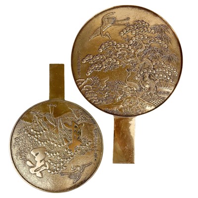 Lot 1439 - Two Japanese polished bronze mirrors.