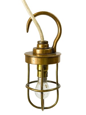 Lot 17 - A brass cage engine inspection lamp by B M A C Ltd.