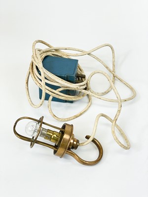 Lot 17 - A brass cage engine inspection lamp by B M A C Ltd.