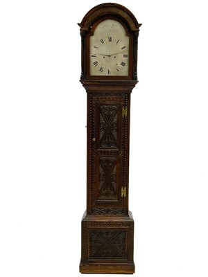 Lot 327 - An oak longcase clock