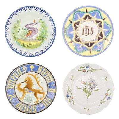 Lot 463 - A Continental Maiolica plate decorated a dragon and verse.