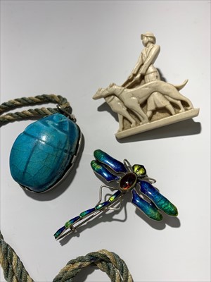 Lot 2423 - An enamelled silver dragonfly brooch, a scarab...