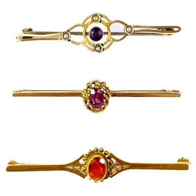 Lot 358 - Three 9ct gold gem set bar brooches.