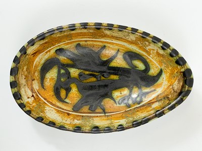 Lot 448 - A Celtic Newlyn Pottery Folksy dish.