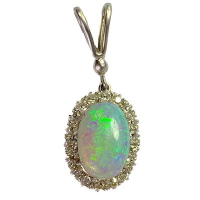 Lot 41 - A white opal and diamond cluster white gold pendant.