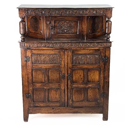 Lot 384 - An oak court cupboard.