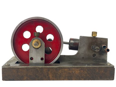 Lot 211 - A miniature engineer apprentice model of a piston and flywheel.